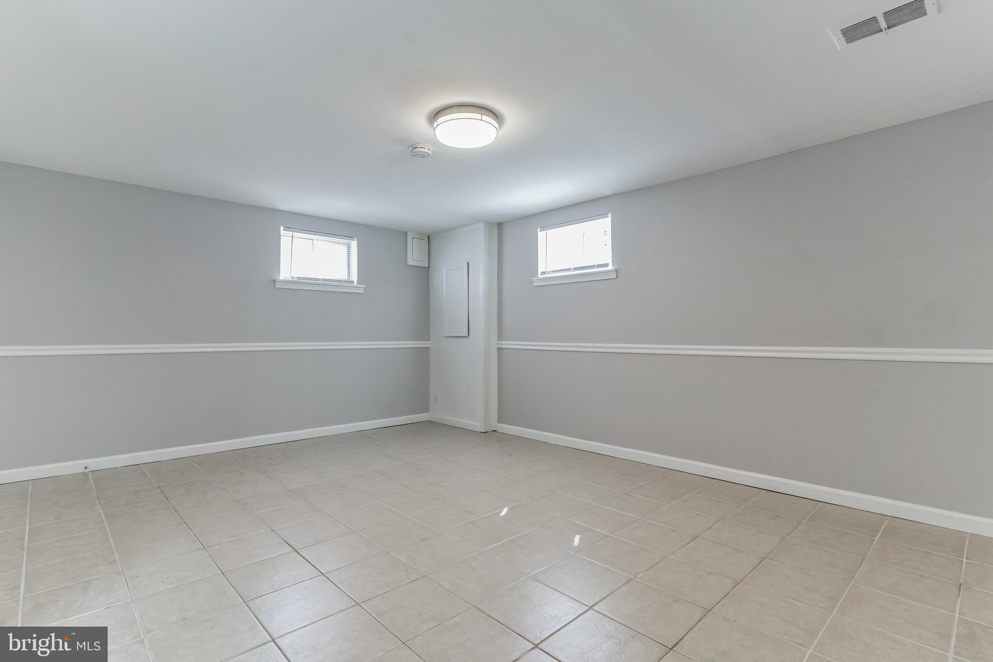 6414 Winnepeg Road Bethesda, MD 20817 - Photo 17 of 20 an empty room with windows