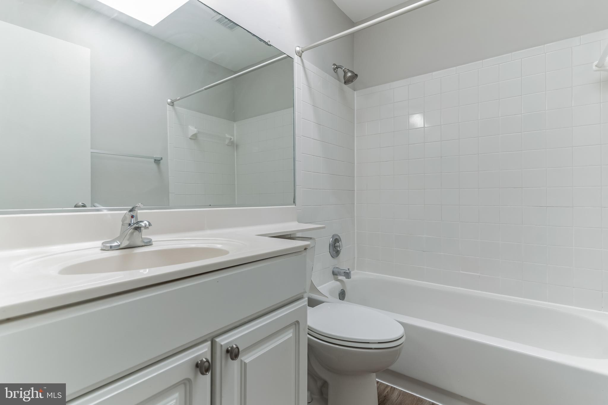 6414 Winnepeg Road Bethesda, MD 20817 - Photo 18 of 20 a bathroom with a sink a toilet and a bathtub