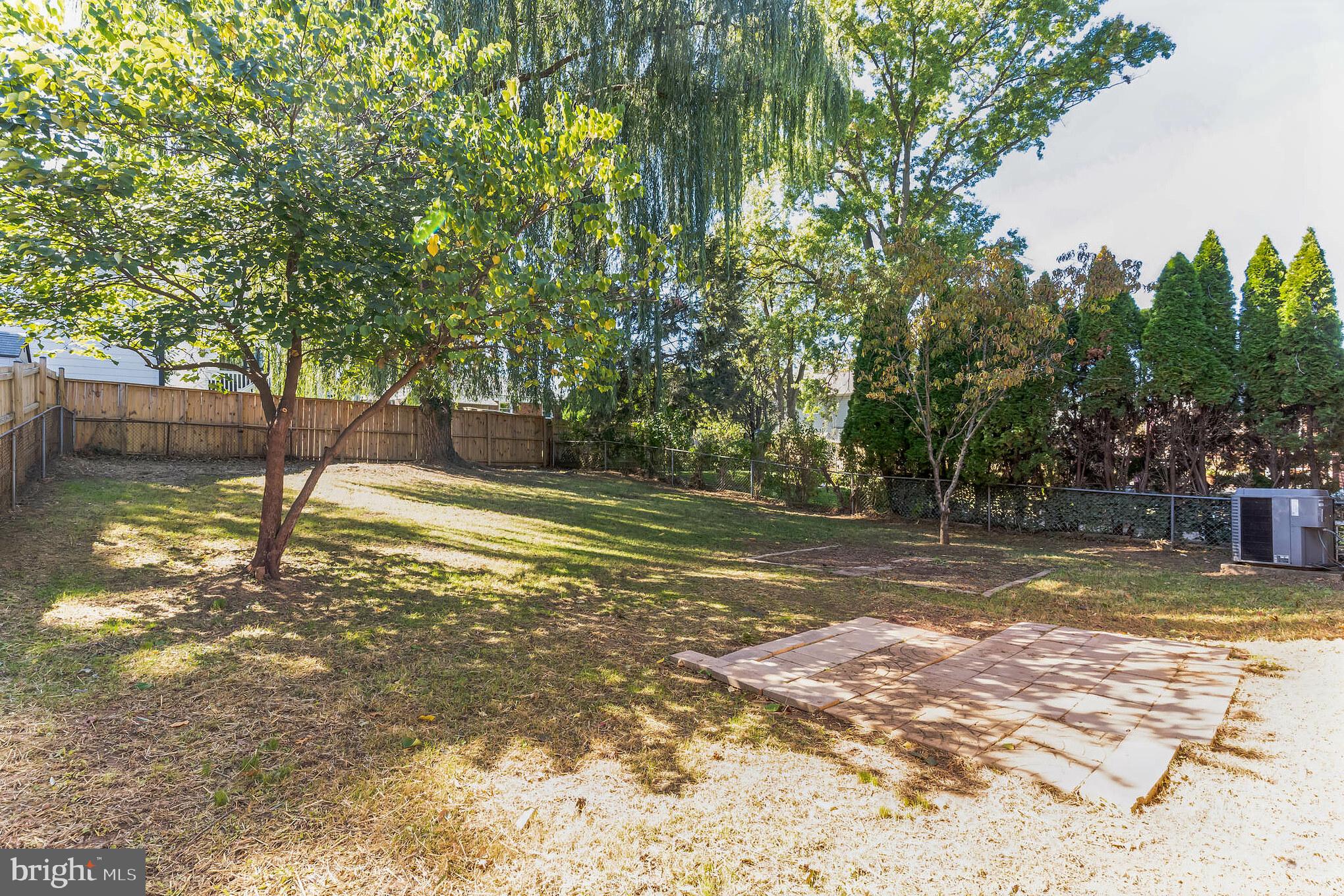 6414 Winnepeg Road Bethesda, MD 20817 - Photo 19 of 20 a view of a yard with a tree