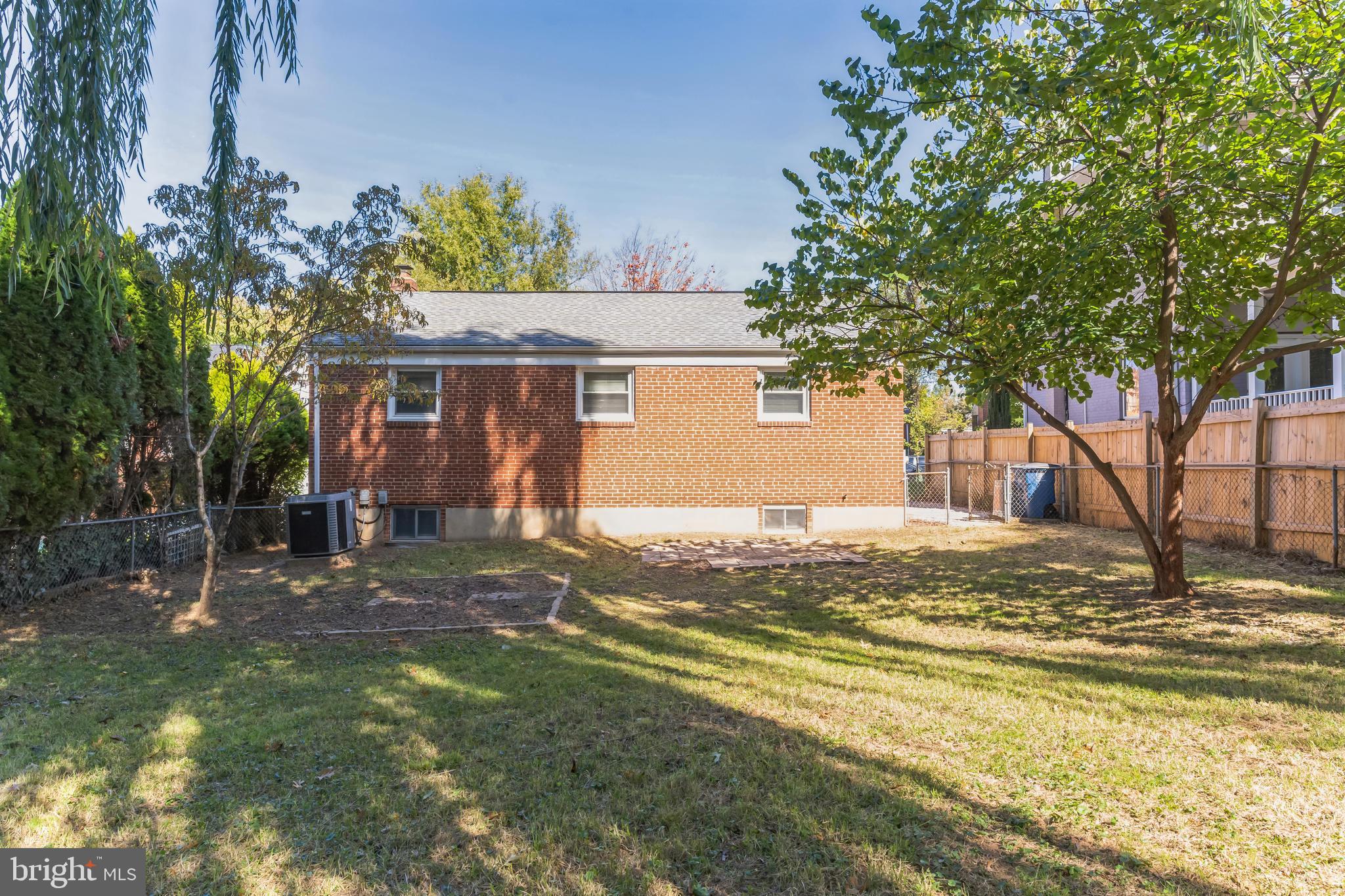 6414 Winnepeg Road Bethesda, MD 20817 - Photo 20 of 20 a view of a house with a yard