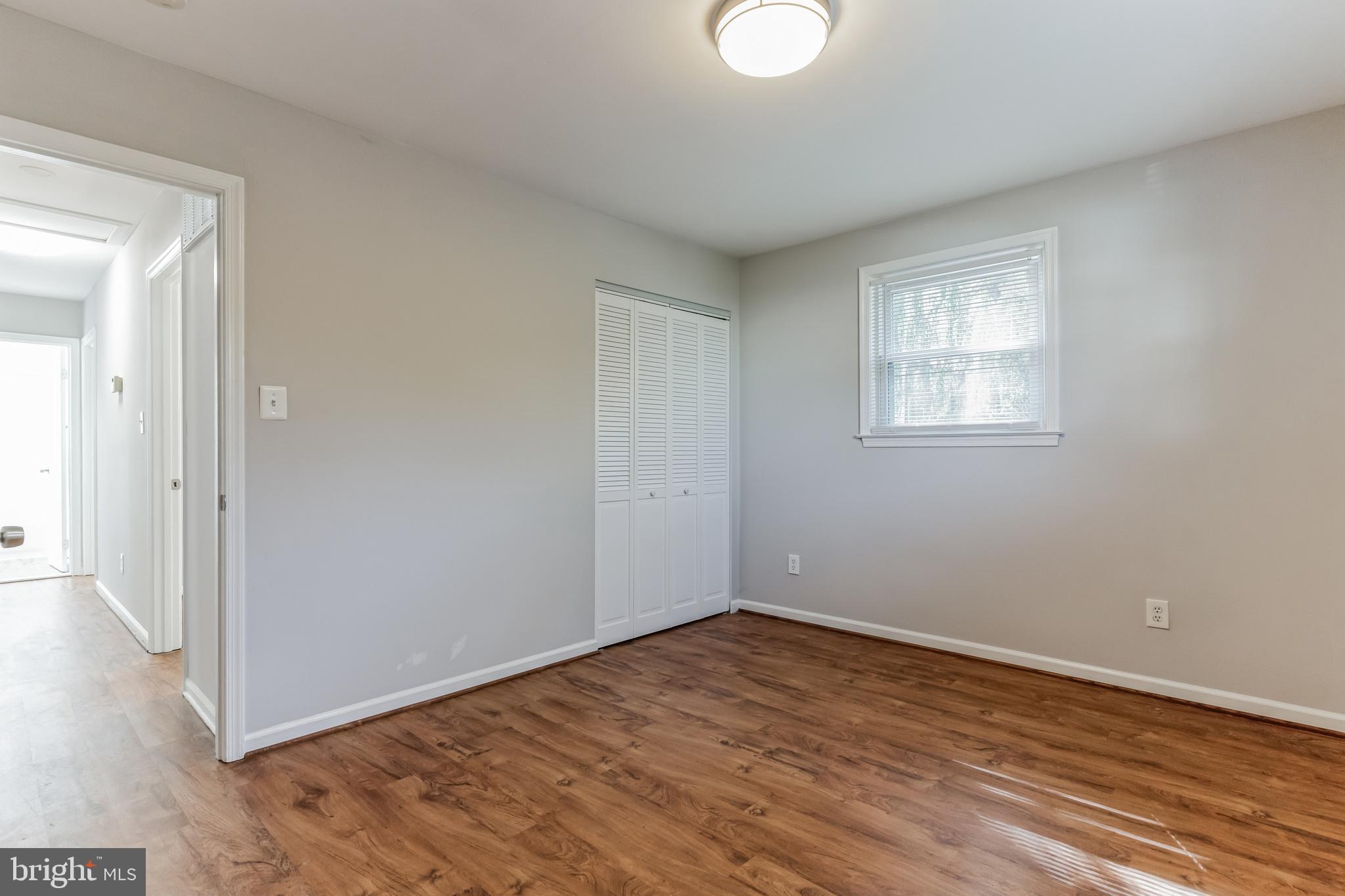 6414 Winnepeg Road Bethesda, MD 20817 - Photo 9 of 20 a view of empty room with wooden floor