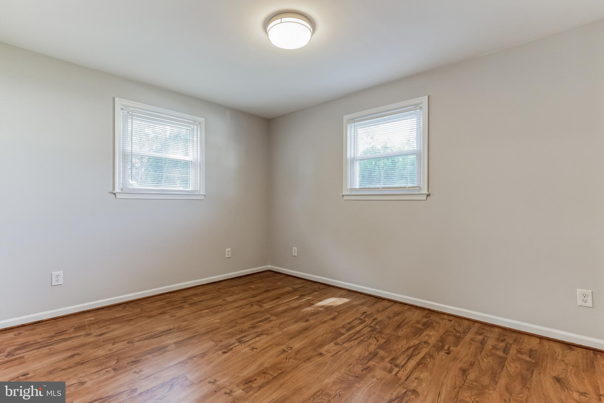 6414 Winnepeg Road Bethesda, MD 20817 - Photo 10 of 20 wooden floor in an empty room with a window