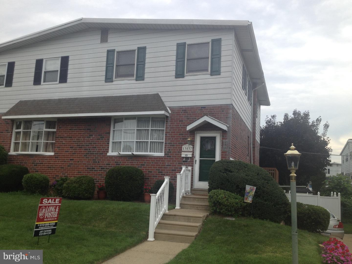 13037 Worthington Road Philadelphia, PA 19116 - Photo 1 of 15 a front view of a house with garden