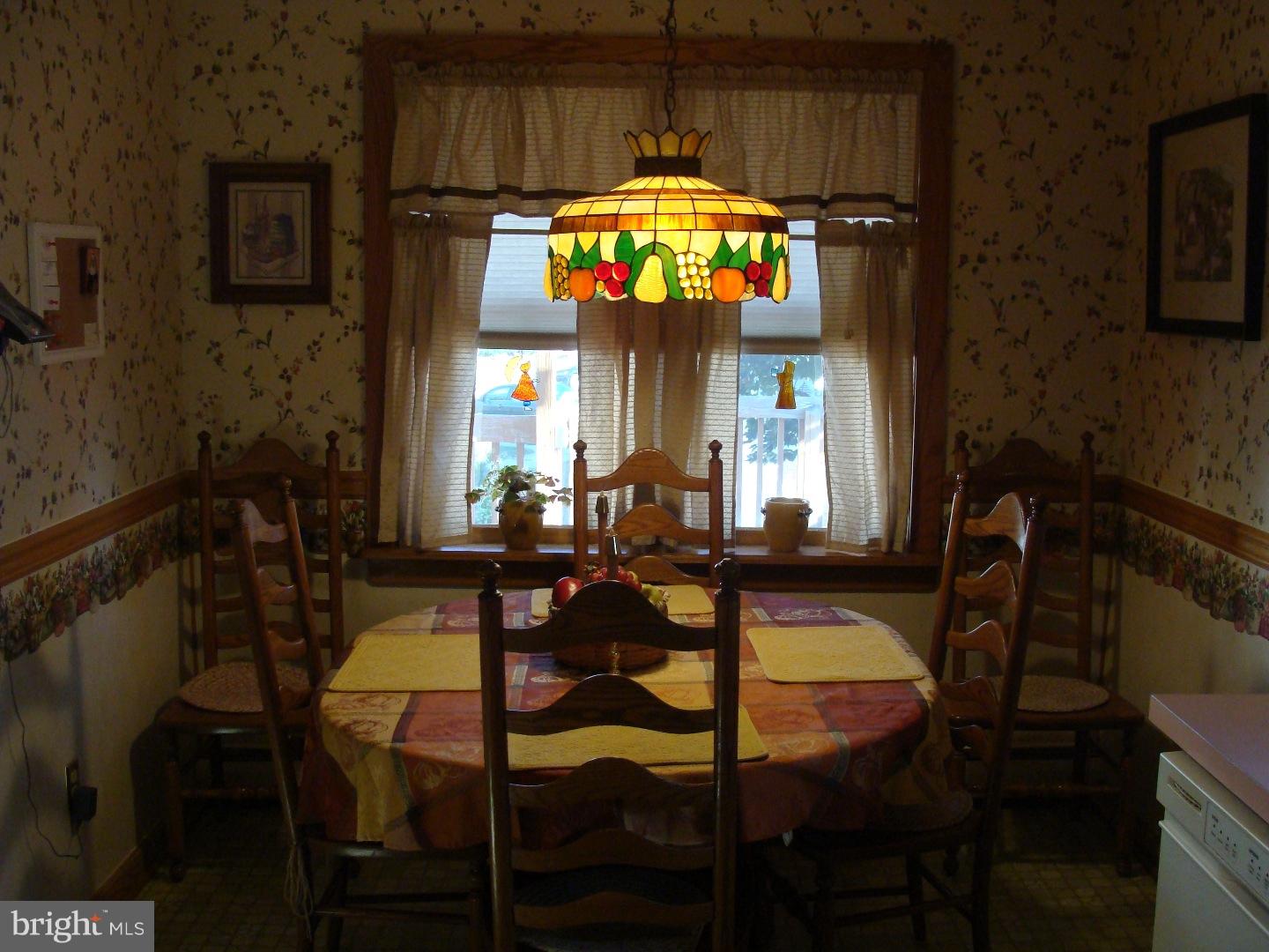 13037 Worthington Road Philadelphia, PA 19116 - Photo 5 of 15 a view of a dining room with furniture and chandelier