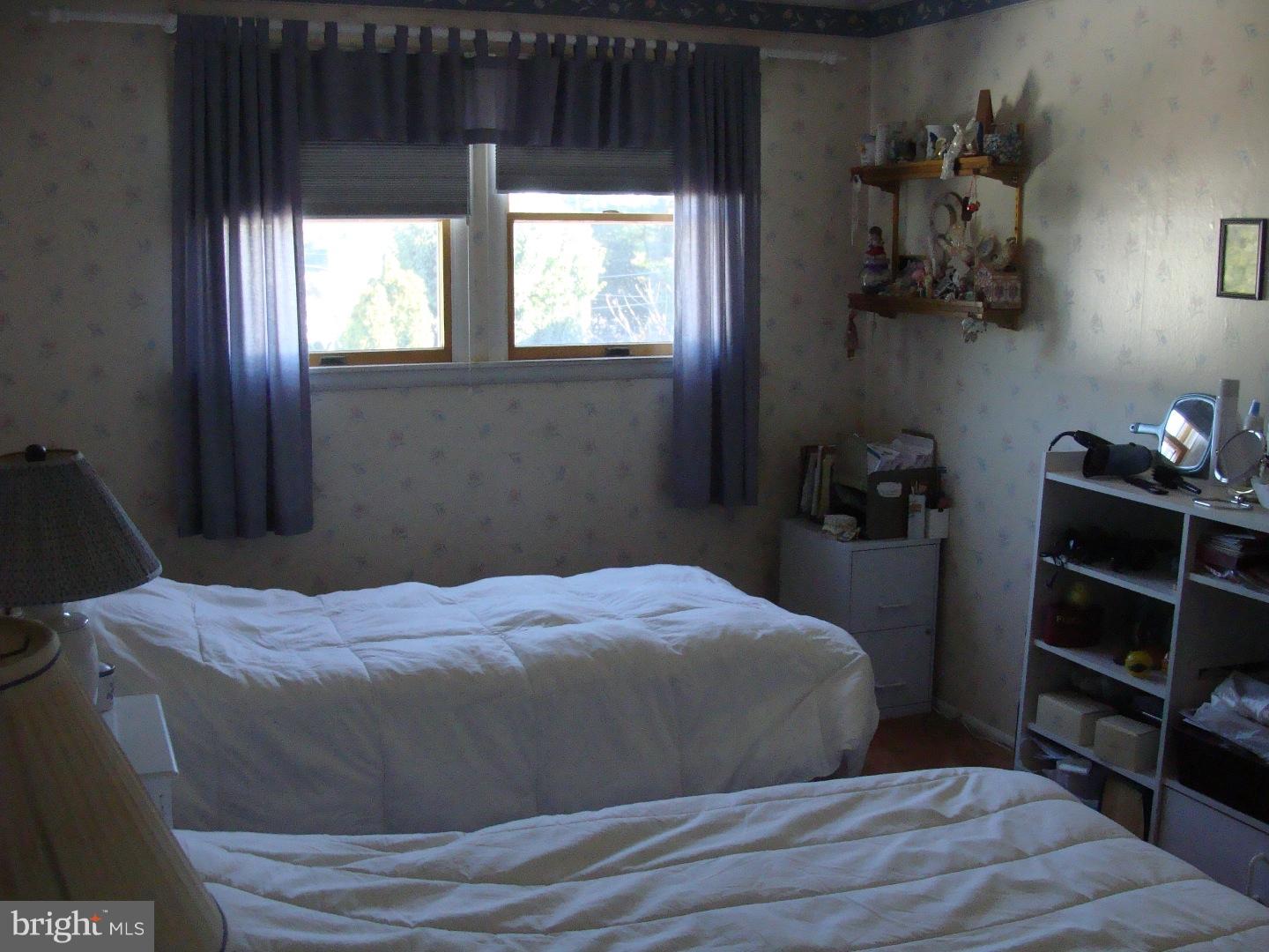 13037 Worthington Road Philadelphia, PA 19116 - Photo 6 of 15 a bedroom with a bed and window