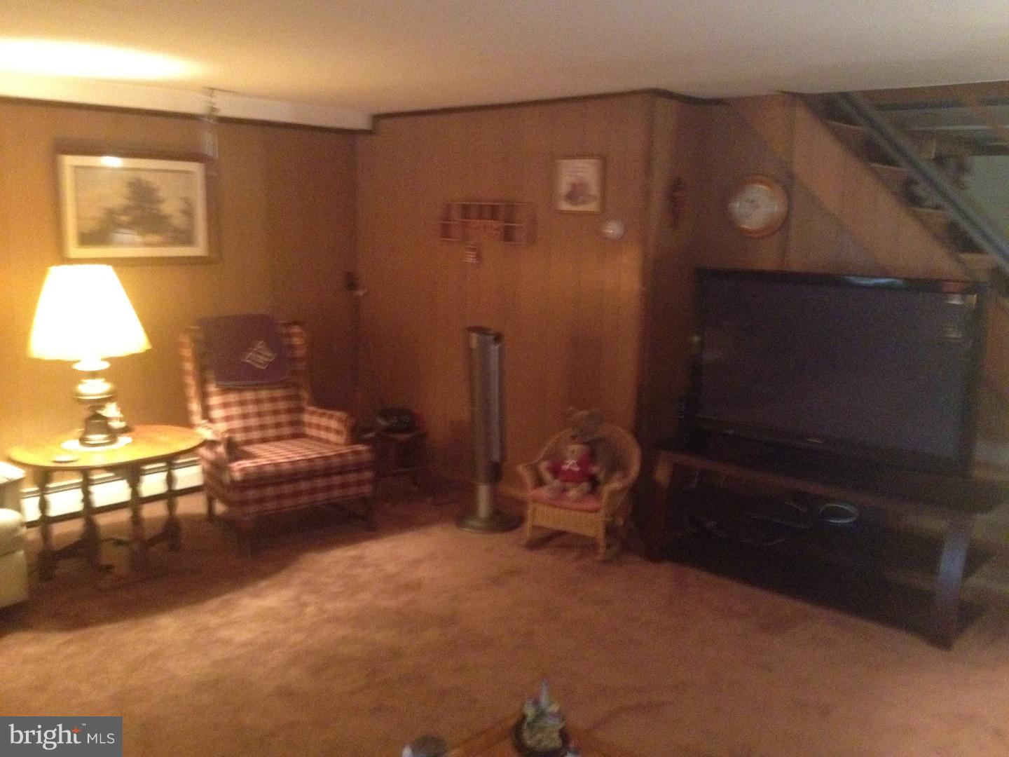 13037 Worthington Road Philadelphia, PA 19116 - Photo 8 of 15 a living room with furniture and a flat screen tv