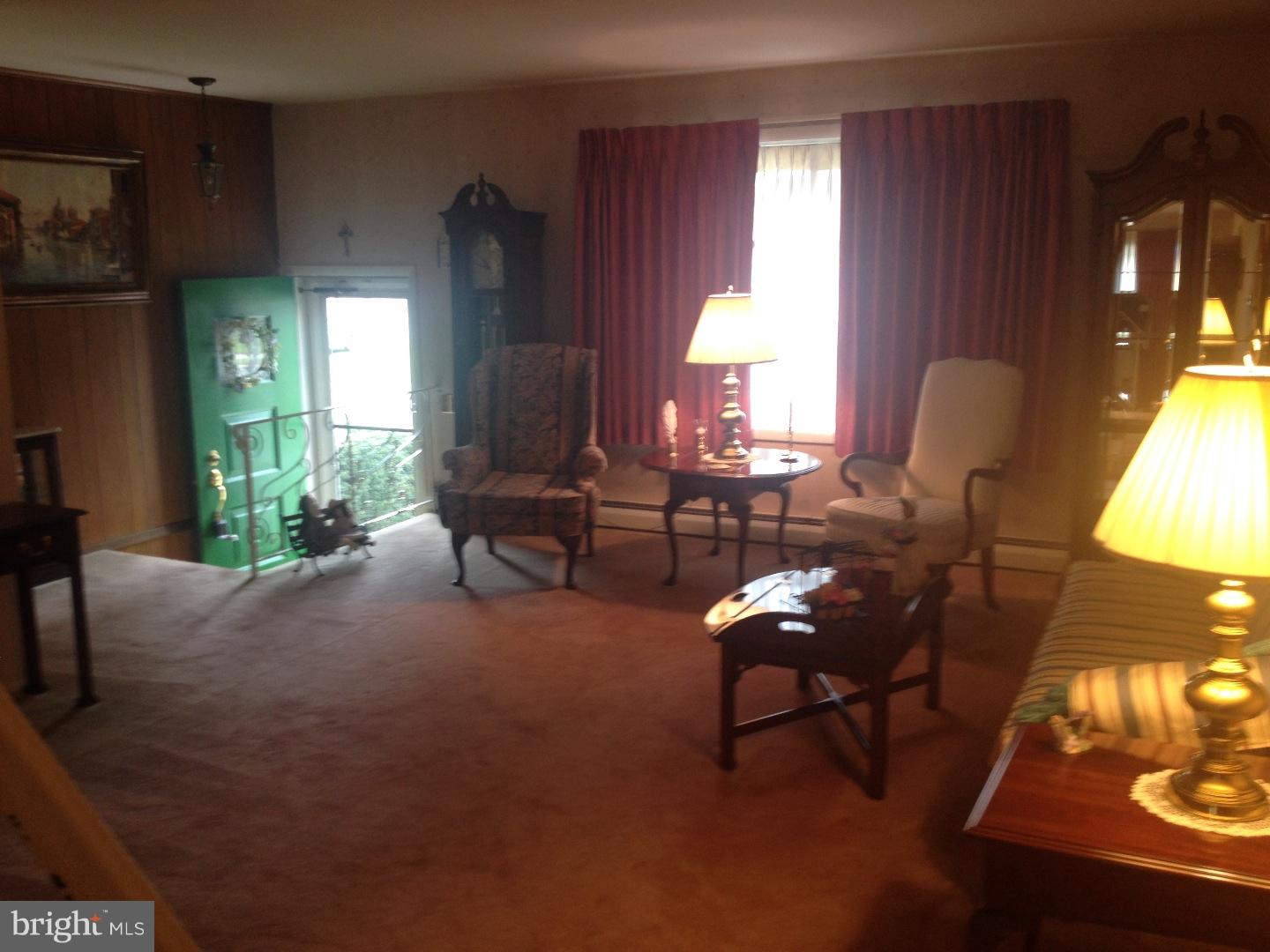13037 Worthington Road Philadelphia, PA 19116 - Photo 10 of 15 a living room with furniture and a large window