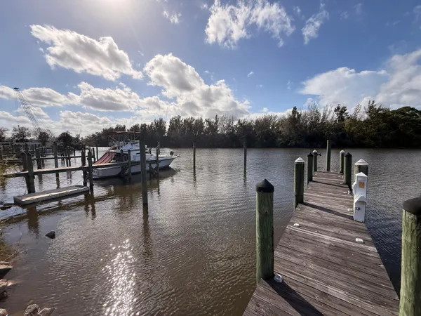 a view of a lake with boats and trees