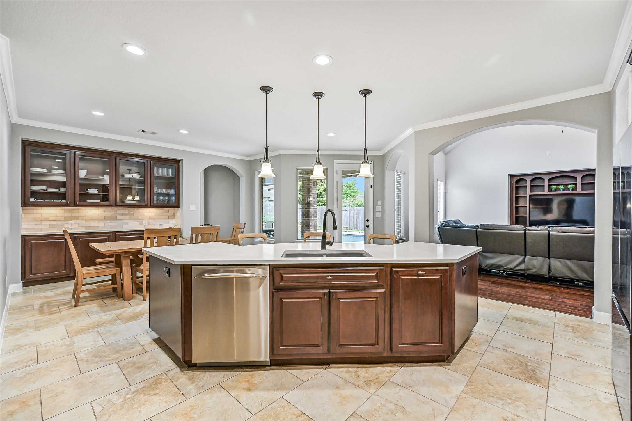 1008 Point Isabel Lane Friendswood, TX 77546 - Photo 17 of 50 The breakfast room offers a bright, open space for casual dining with large windows that bring in natural light and provide views of the backyard and pool area.
