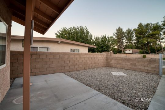324 West Ward Avenue Ridgecrest, CA 93555 - Photo 31 of 32 a backyard of a house with lots of green space