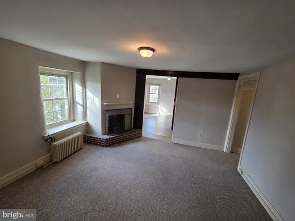 a view of a livingroom with a fireplace