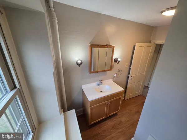 a view of empty room with a fireplace