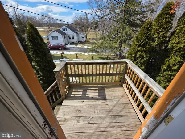 a view of balcony with wooden floor