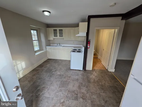a bathroom with a sink and mirror with toilet