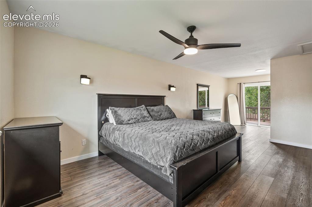 125 Diamond E Road Fountain, CO 80817 - Photo 18 of 43 a bedroom with a bed and large mirror