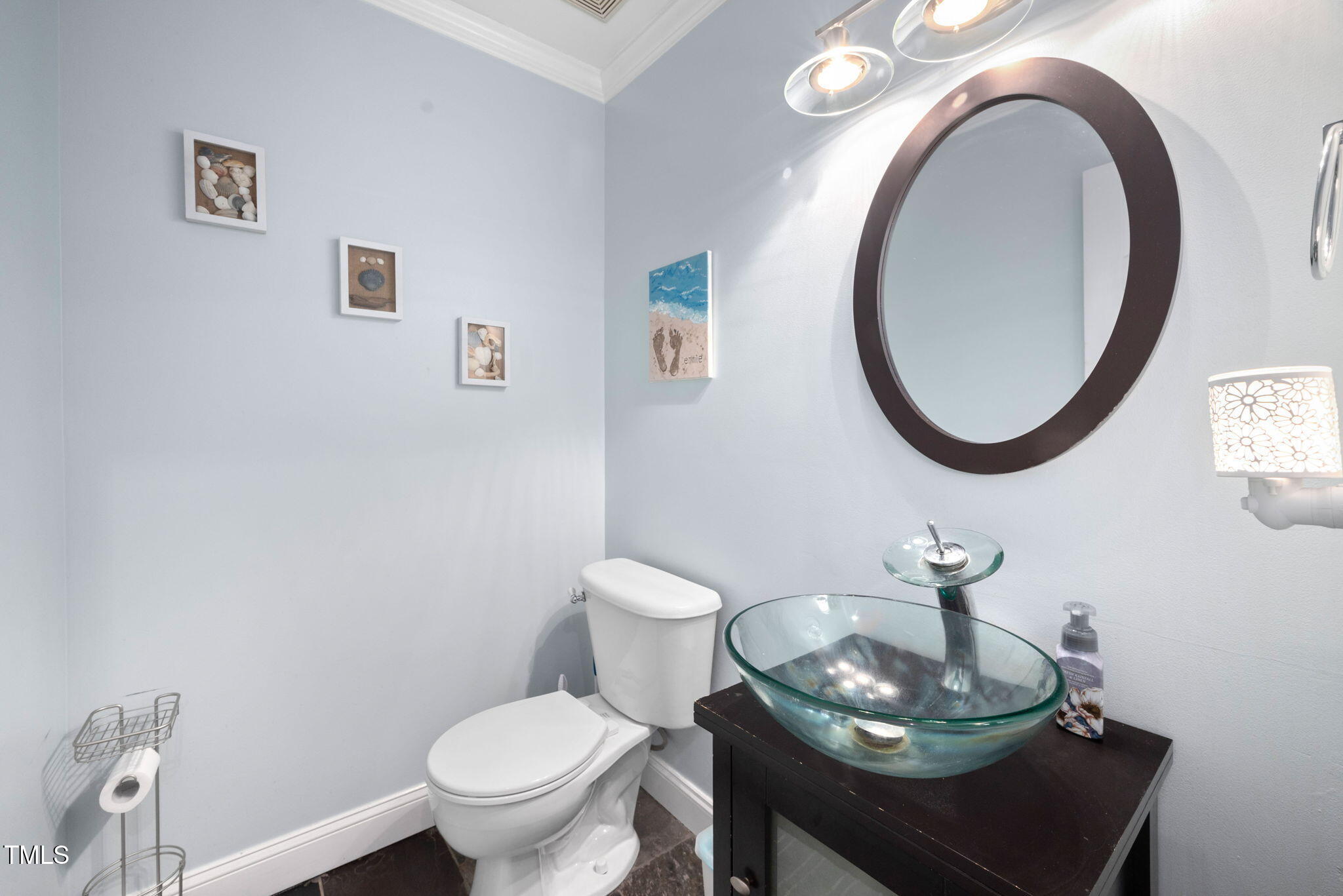 Undisclosed Address Garner, NC 27529 - Photo 15 of 35 a bathroom with a toilet a sink and a mirror