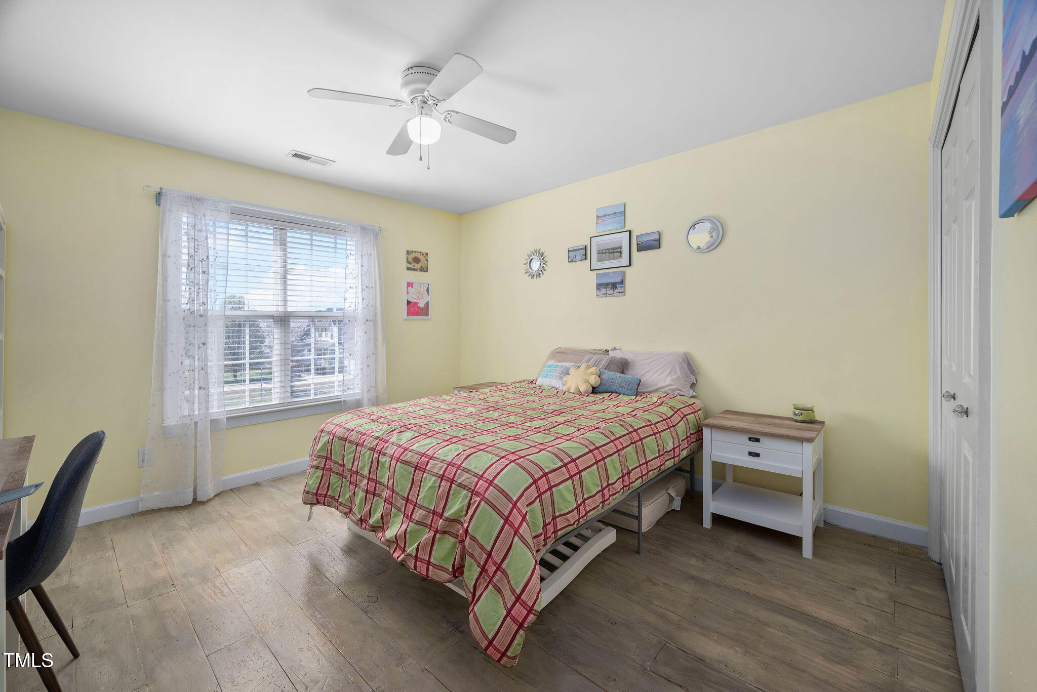 Undisclosed Address Garner, NC 27529 - Photo 19 of 35 a bedroom with a bed and a window