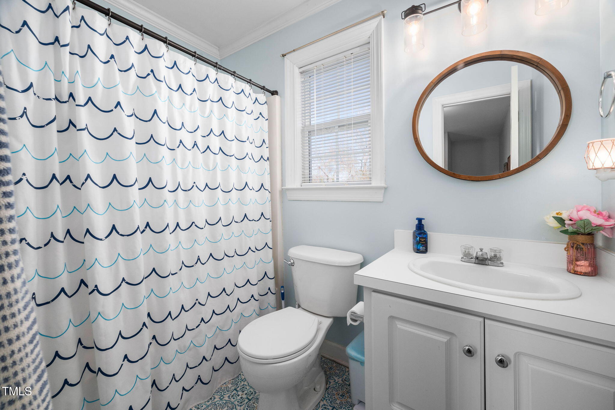 Undisclosed Address Garner, NC 27529 - Photo 23 of 35 a bathroom with a toilet sink vanity and mirror