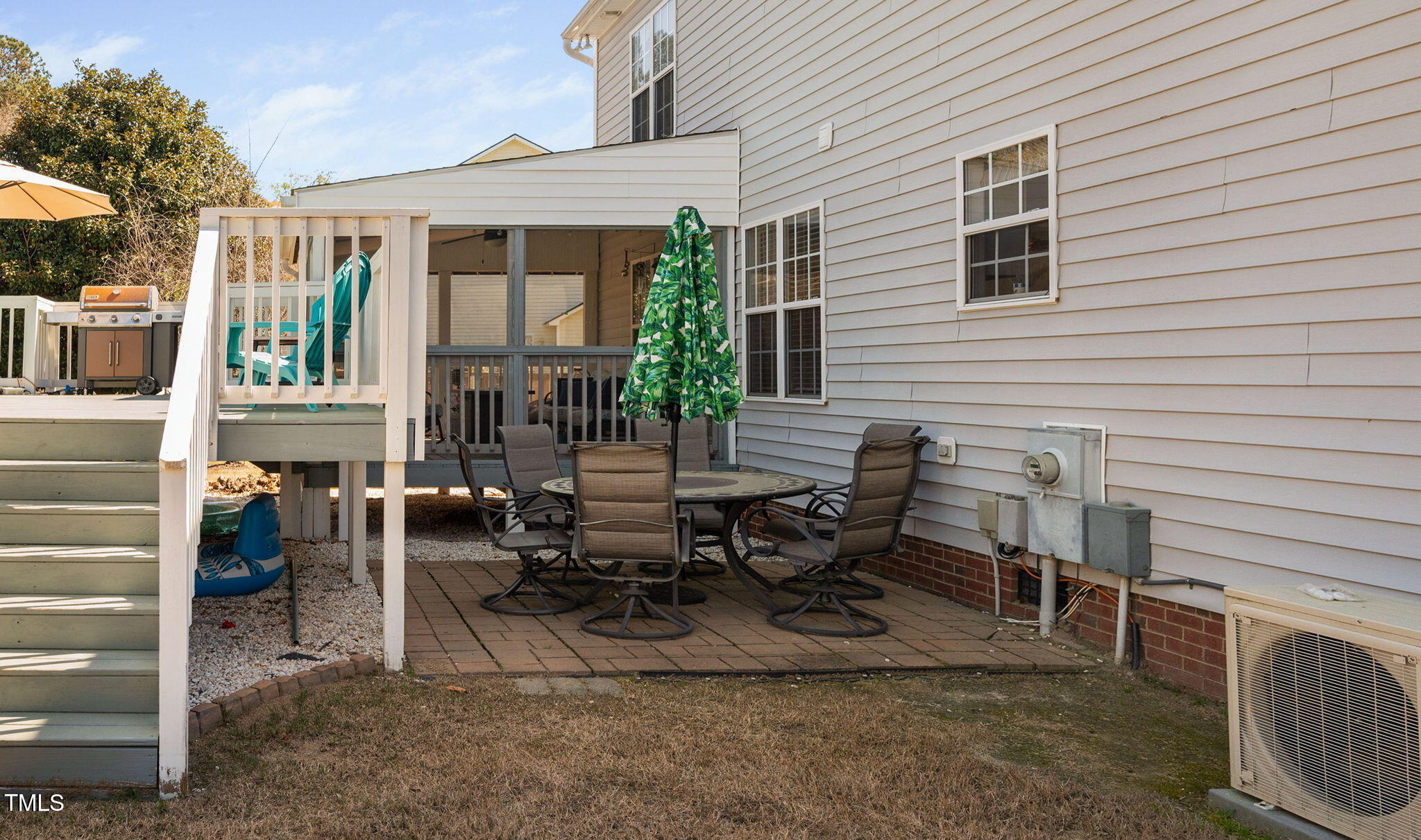 Undisclosed Address Garner, NC 27529 - Photo 28 of 35 a view of a patio with table and chairs and floor to ceiling window