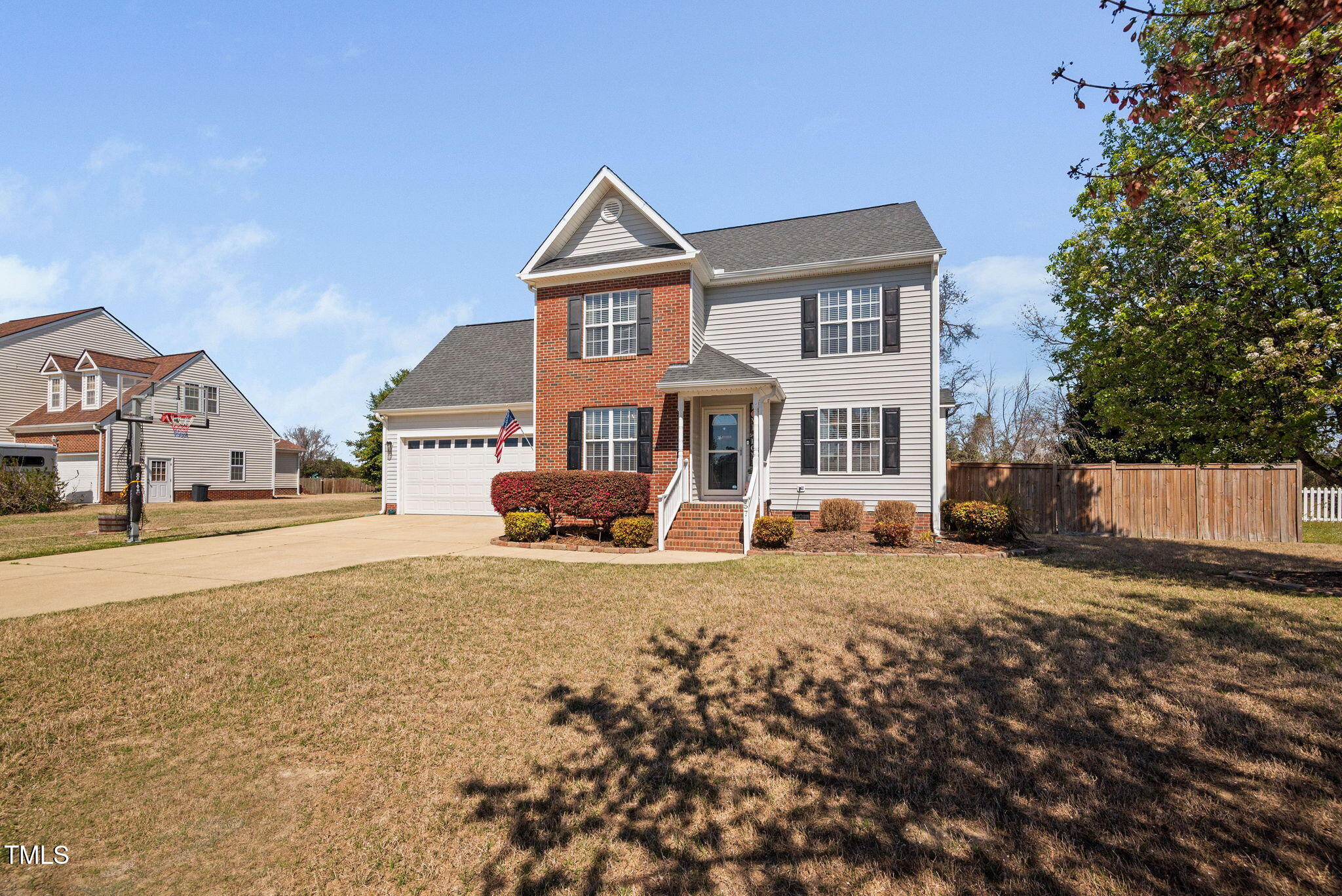 Undisclosed Address Garner, NC 27529 - Photo 2 of 35 a front view of a house with a yard