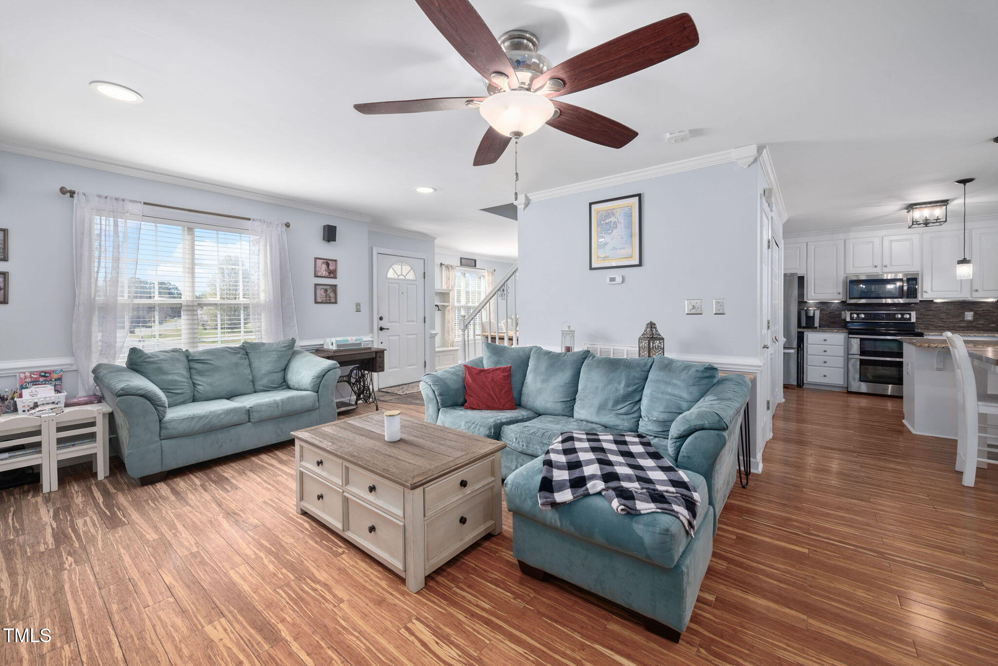 Undisclosed Address Garner, NC 27529 - Photo 5 of 35 a living room with furniture and a wooden floor