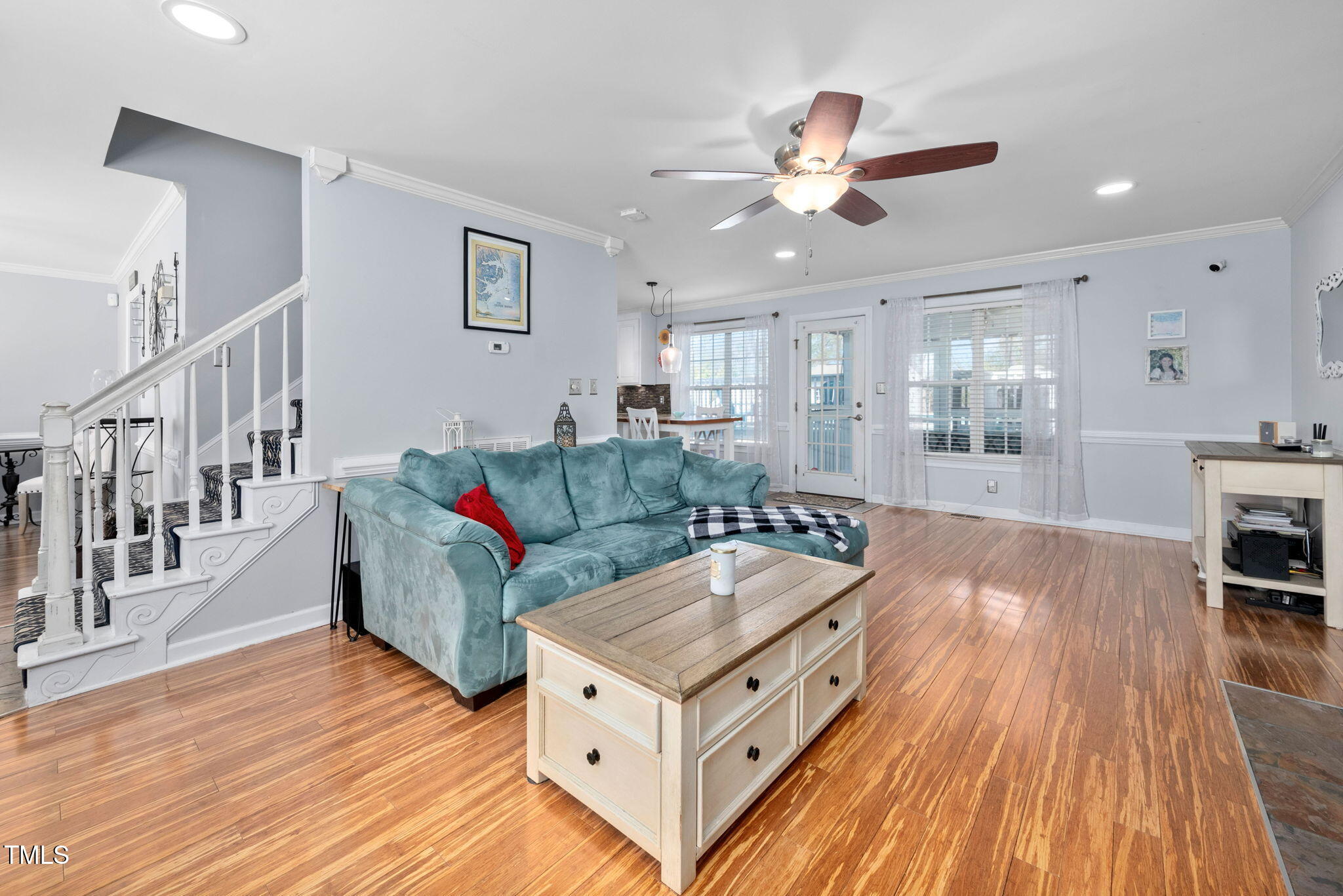 Undisclosed Address Garner, NC 27529 - Photo 7 of 35 a living room with furniture and a wooden floor