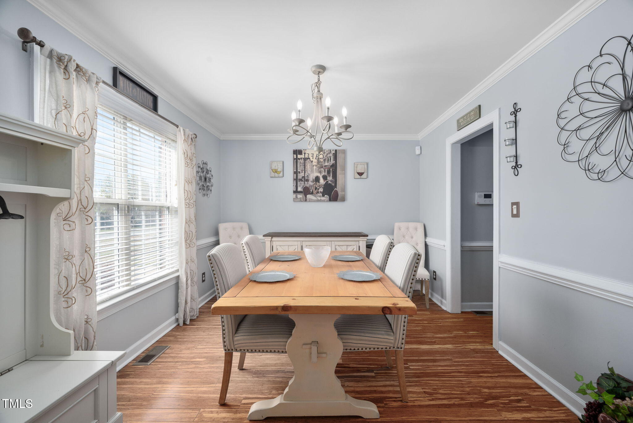 Undisclosed Address Garner, NC 27529 - Photo 9 of 35 a view of a dining room with furniture wooden floor and a chandelier