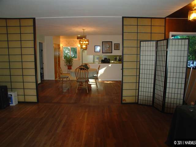 615 Skyline Boulevard Reno, NV 89509 - Photo 3 of 13 a view of a livingroom with furniture and wooden floor