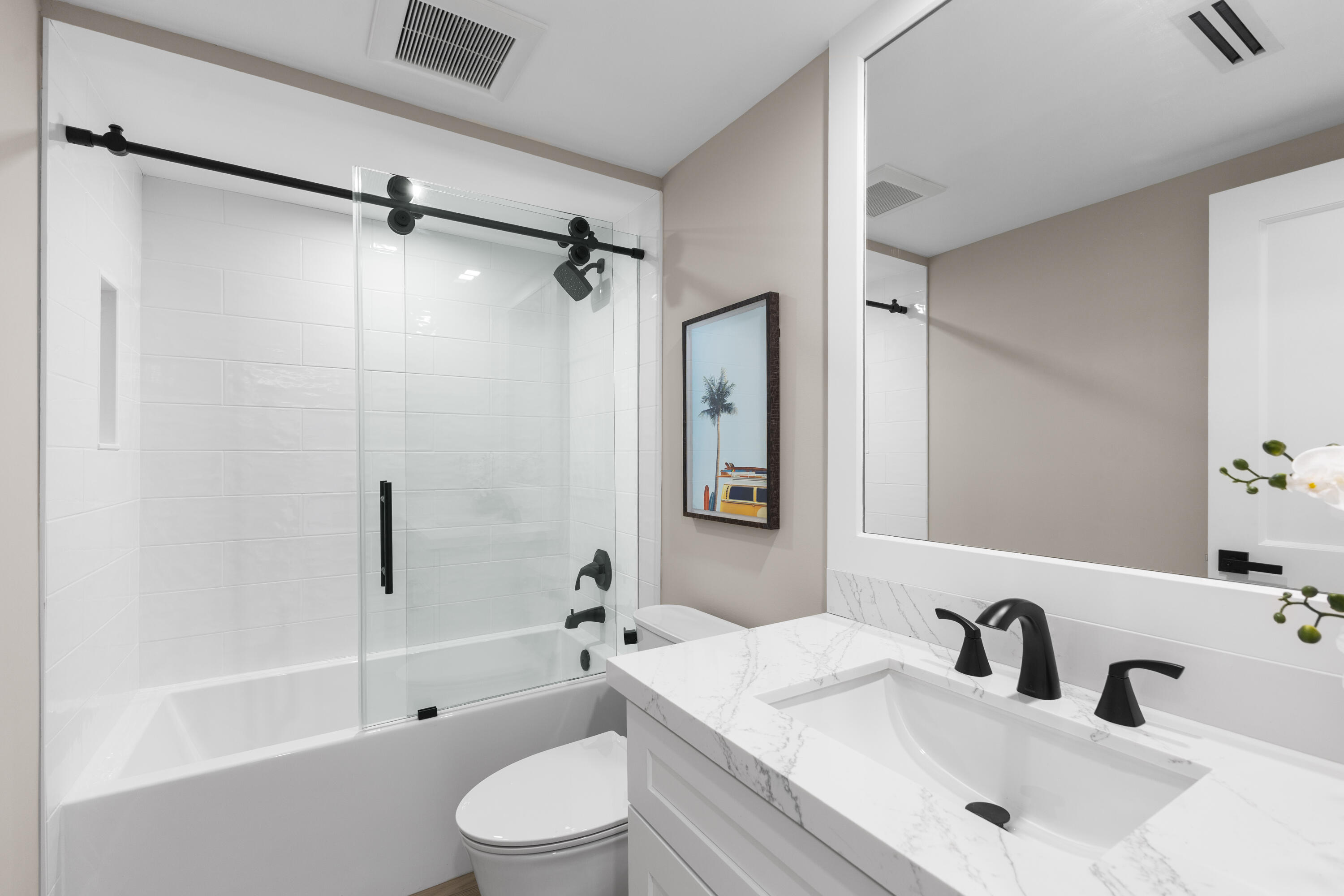 400 Ocean Trail Way, Unit 1008 Jupiter, FL 33477 - Photo 18 of 25 a bathroom with a sink toilet and shower