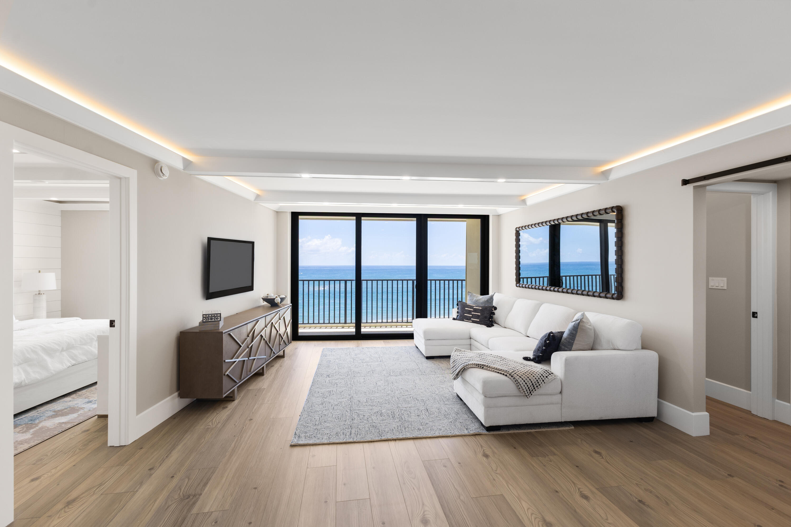 400 Ocean Trail Way, Unit 1008 Jupiter, FL 33477 - Photo 4 of 25 a living room with furniture and a flat screen tv