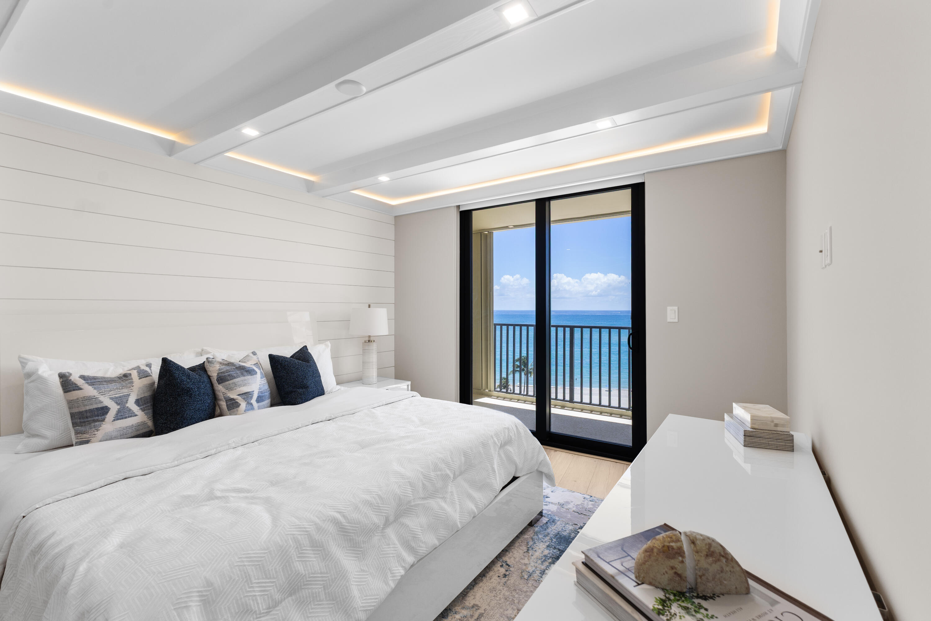 400 Ocean Trail Way, Unit 1008 Jupiter, FL 33477 - Photo 10 of 25 a bedroom with a bed and a dresser