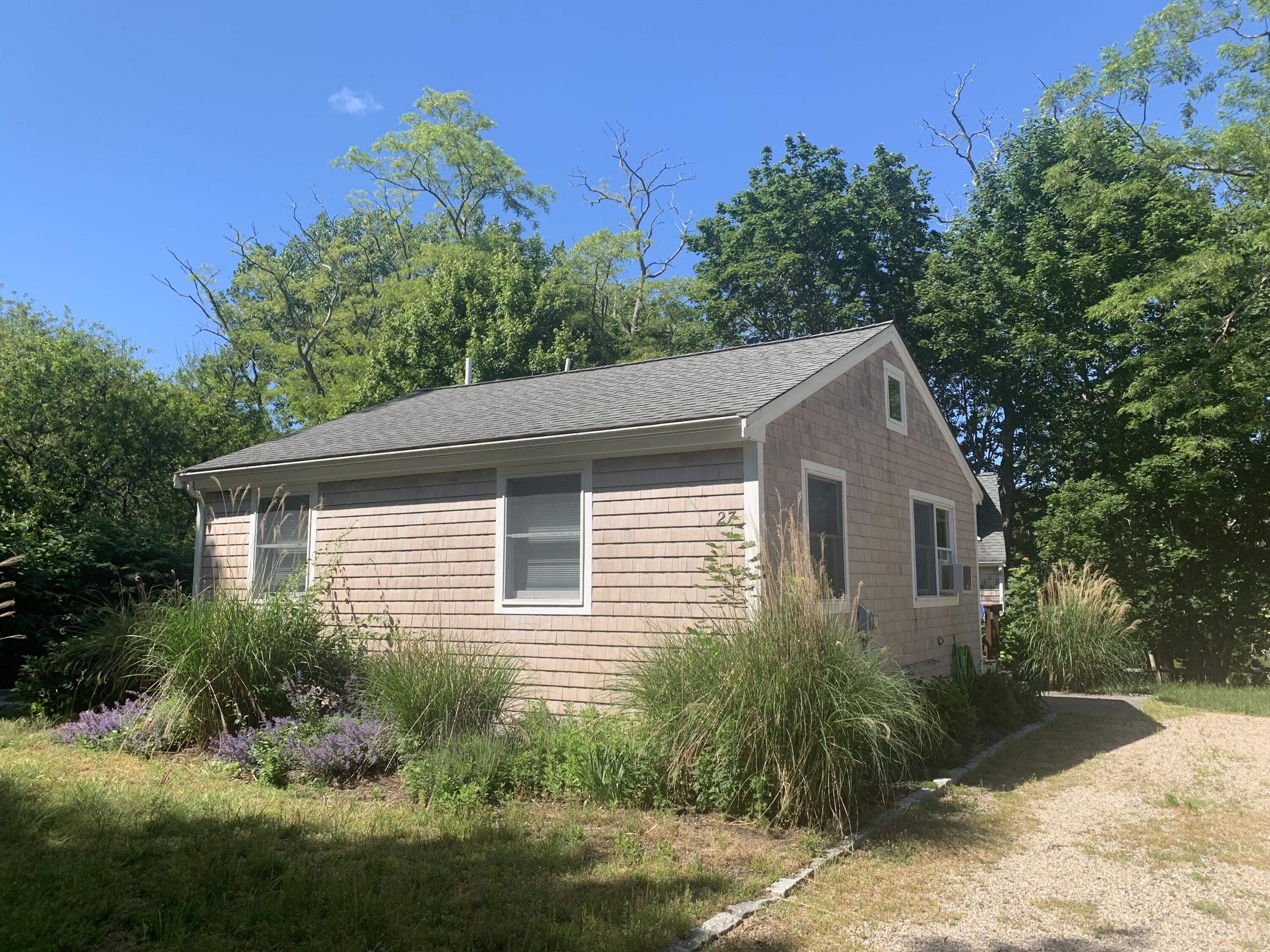 27 Locust Road, Unit 2 Eastham, MA 02642 - Photo 21 of 21 a view of a house with a yard
