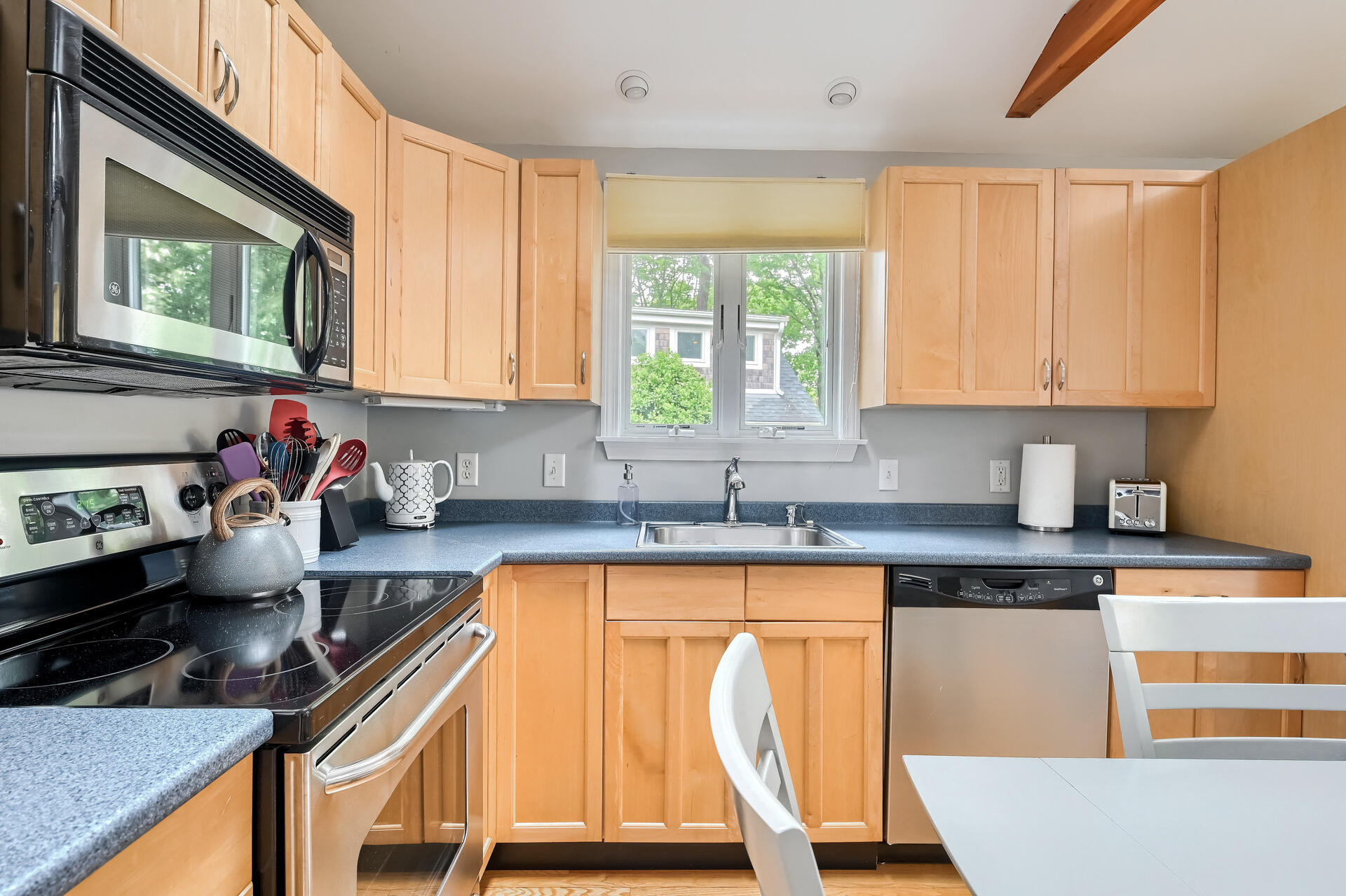 27 Locust Road, Unit 2 Eastham, MA 02642 - Photo 7 of 21 a kitchen with granite countertop a stove a sink and a granite counter tops