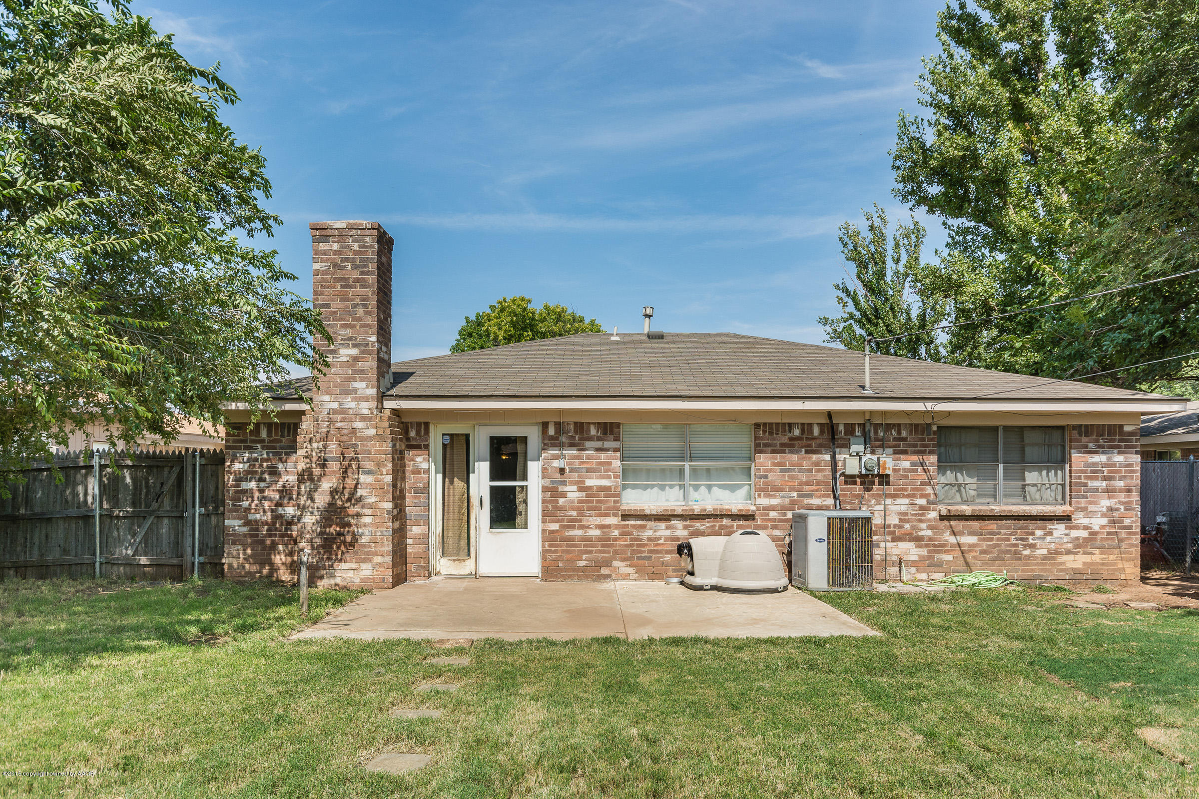 5017 Tulip Avenue Amarillo, TX 79110 - Photo 13 of 16 a front view of a house with garden
