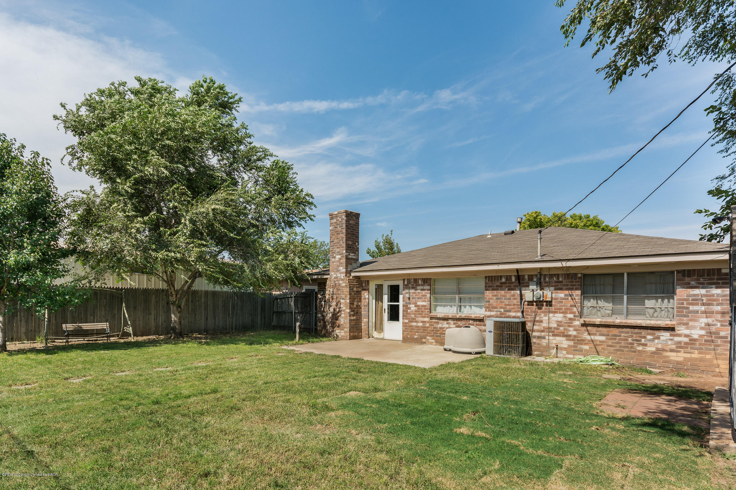 5017 Tulip Avenue Amarillo, TX 79110 - Photo 14 of 16 a front view of a house with a yard