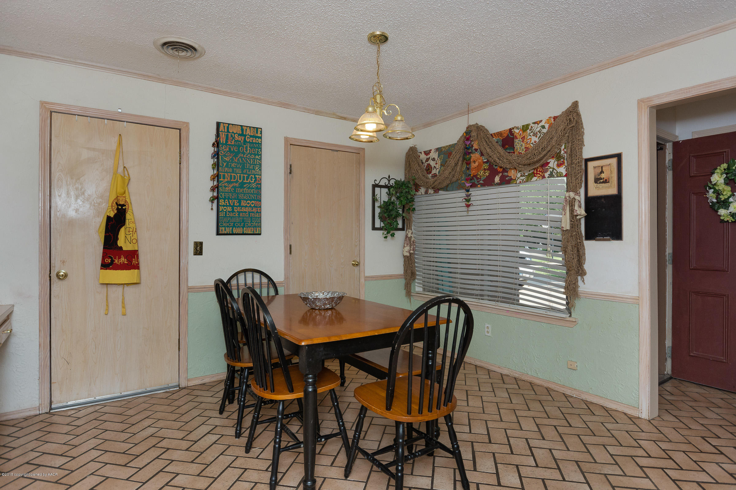 5017 Tulip Avenue Amarillo, TX 79110 - Photo 4 of 16 a dining room with furniture and window