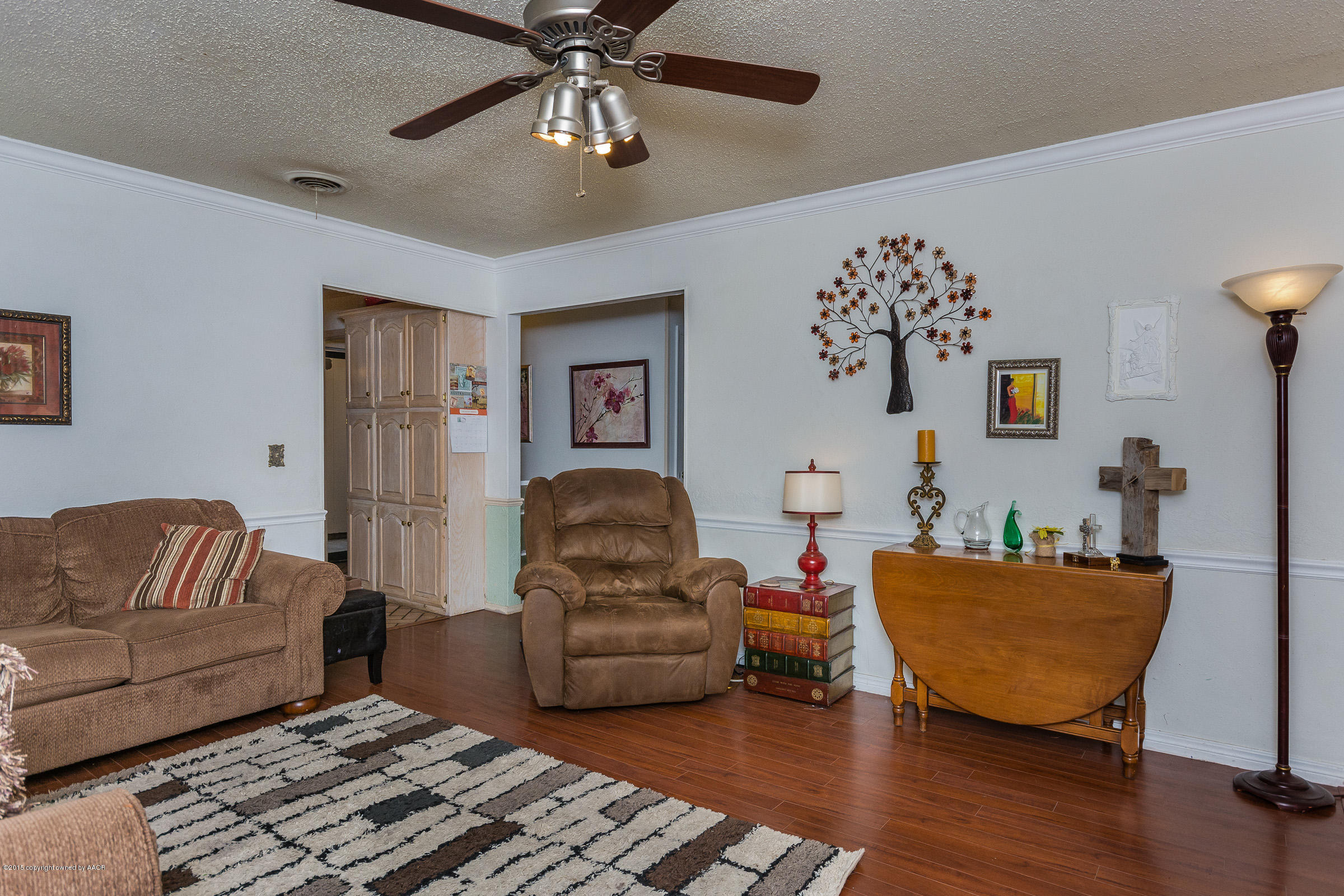 5017 Tulip Avenue Amarillo, TX 79110 - Photo 5 of 16 a living room with furniture and a couch