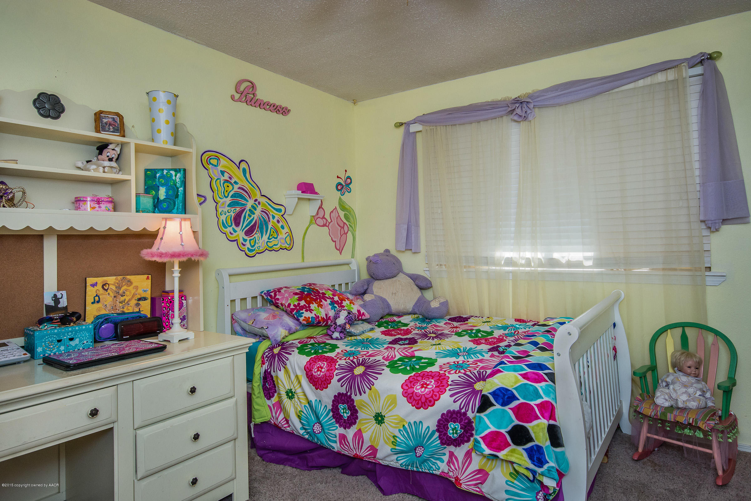 5017 Tulip Avenue Amarillo, TX 79110 - Photo 9 of 16 a bedroom with a bed and a window