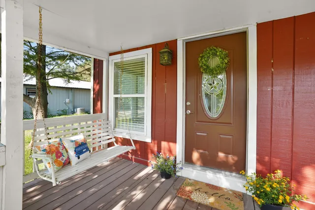 a living room filled with furniture and a window