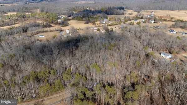 a aerial view of a house with a yard