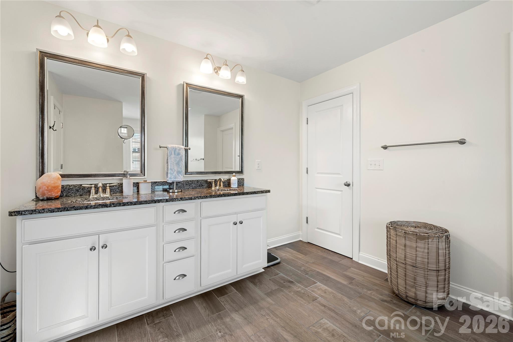 11266 Trailside Road Concord, NC 28027 - Photo 42 of 48 a spacious bathroom with a granite countertop sink and a mirror