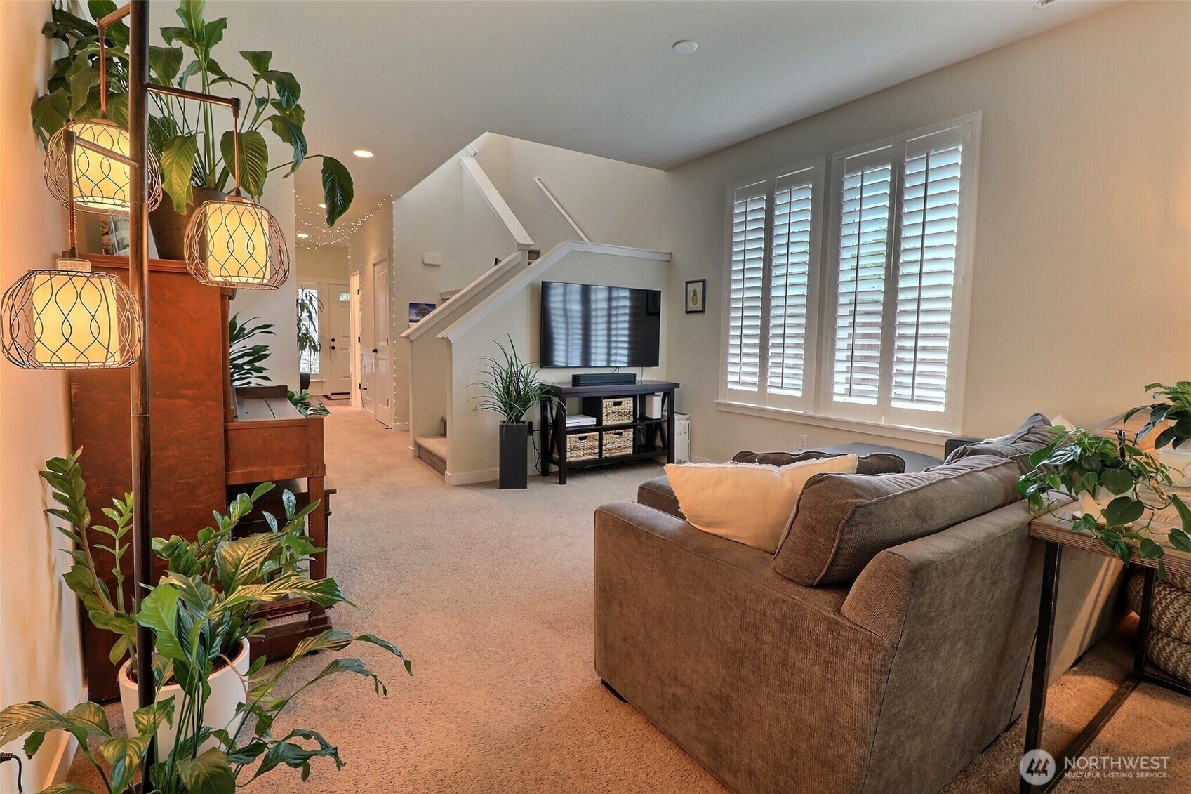 19776 Mountain Ridge Road Southeast Monroe, WA 98272 - Photo 8 of 40 a living room with furniture and a potted plant