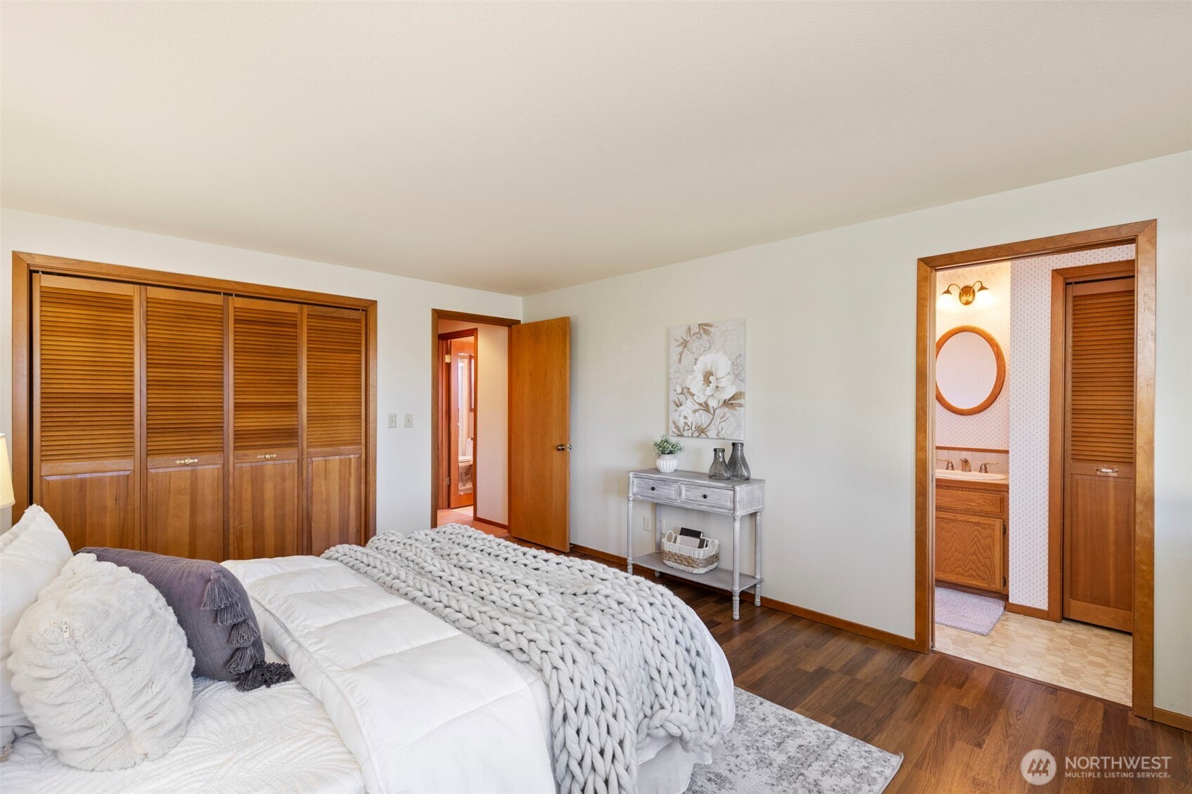 909 55th Street Port Townsend, WA 98368 - Photo 13 of 36 a bedroom with a bed and wooden floor
