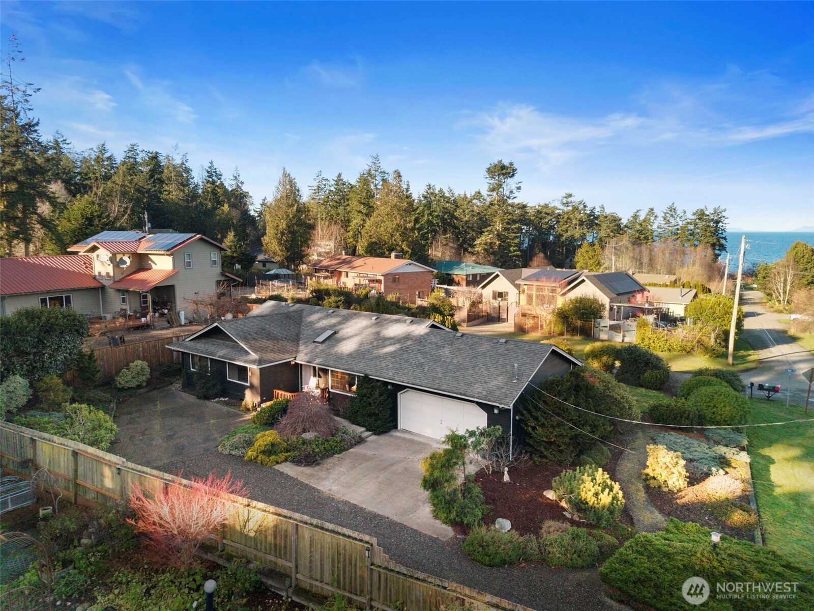 909 55th Street Port Townsend, WA 98368 - Photo 23 of 36 an aerial view of a house with a yard basket ball court and outdoor seating