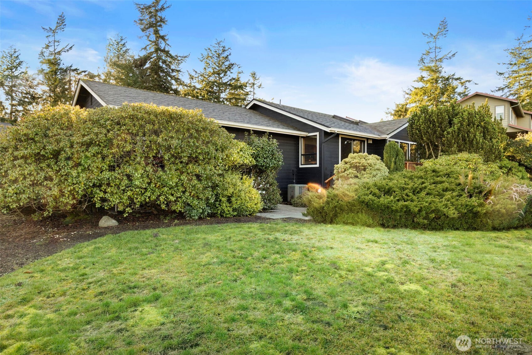 909 55th Street Port Townsend, WA 98368 - Photo 24 of 36 a view of a house with a garden