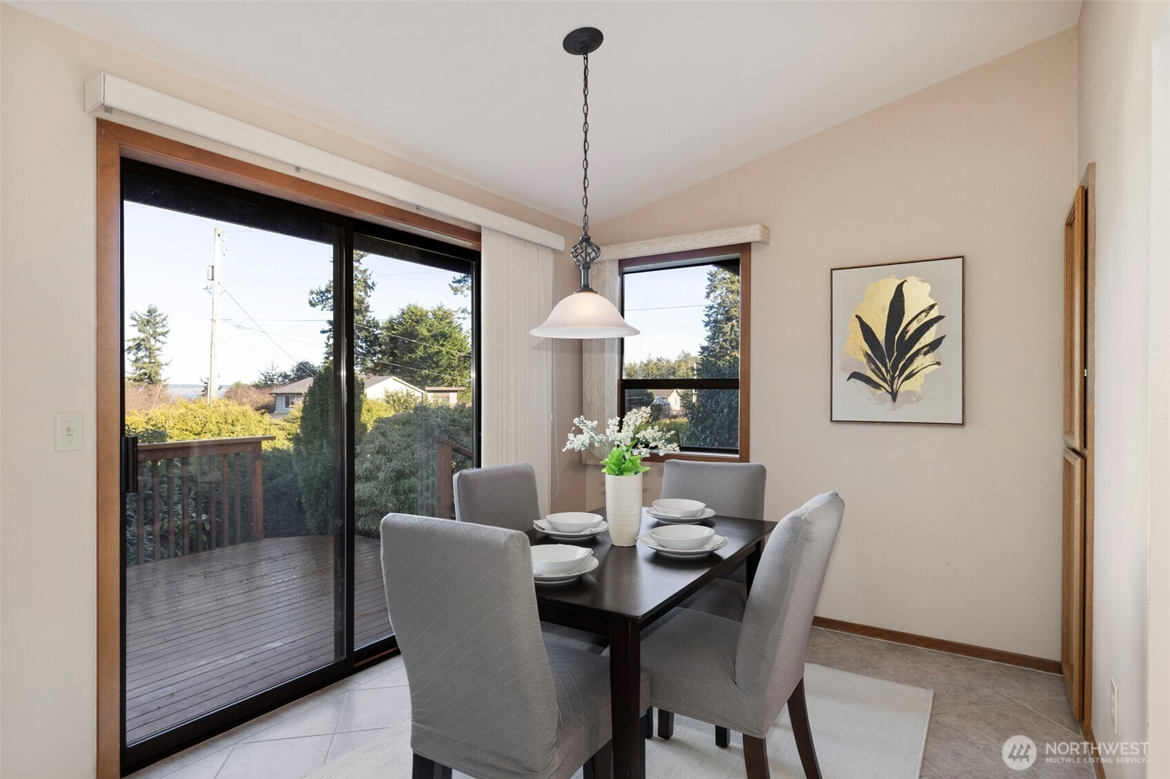 909 55th Street Port Townsend, WA 98368 - Photo 7 of 36 a dining room with furniture a chandelier and wooden floor