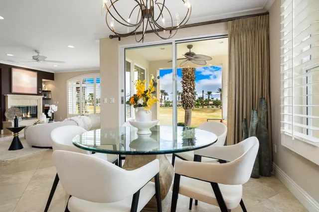 a kitchen with kitchen island granite countertop wooden cabinets and stainless steel appliances