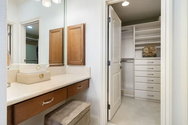 a spacious bedroom with a bed and a window