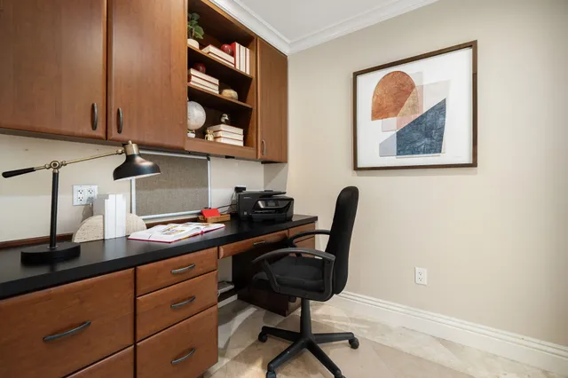 a bathroom with a granite countertop sink mirror vanity and toilet