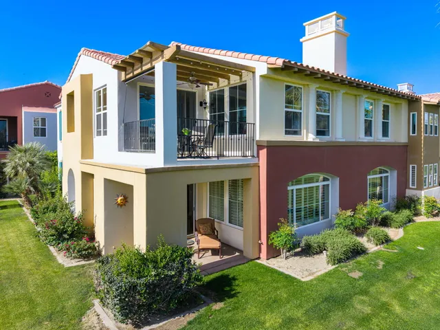 a view of residential houses with outdoor space